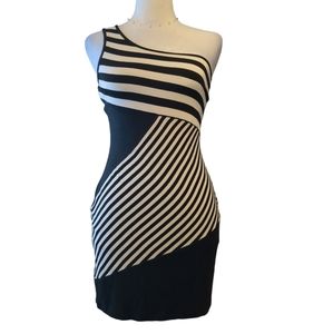 Bebe Mini dress size M design has strips and just one sleeve color Black/white